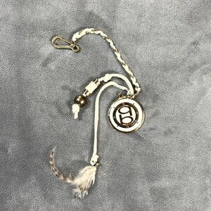 Bebe White and Gold Key Chain